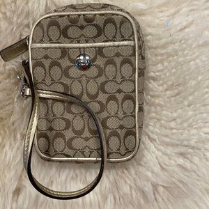 Small Coach accessory bag.  Perfect for a small wallet or lipstick holder.